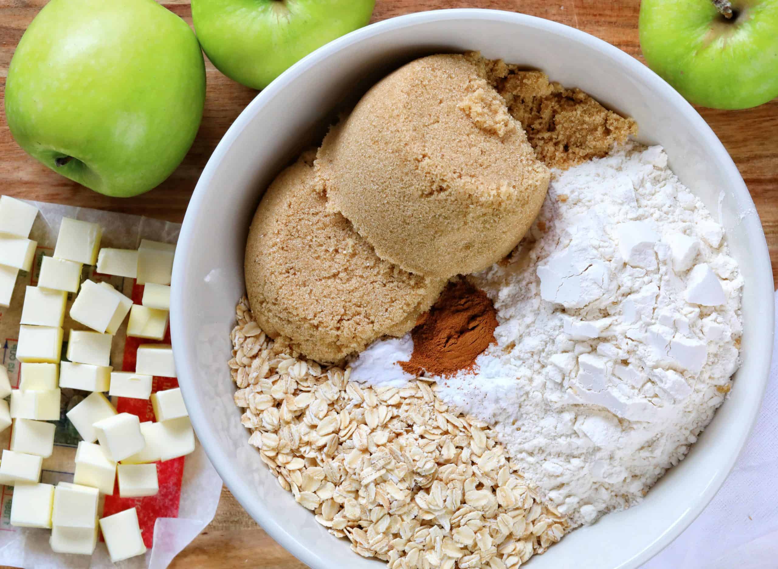 How to Make Apple Crisp, Raw Ingredients in Bowl and on Cutting Board.