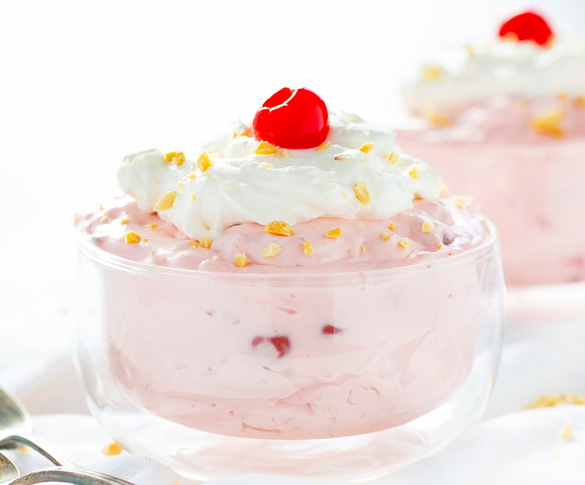 Banana Split Fluff Easy in Glass Bowl with Cherry on Top.