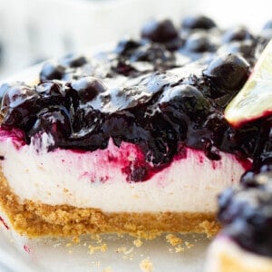 Inside of Blueberry Lemon Cream Pie Still in Pie Plate with a Piece Removed Showing Inside.