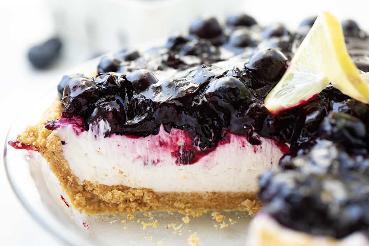 Inside of Blueberry Lemon Cream Pie Still in Pie Plate with a Piece Removed Showing Inside.