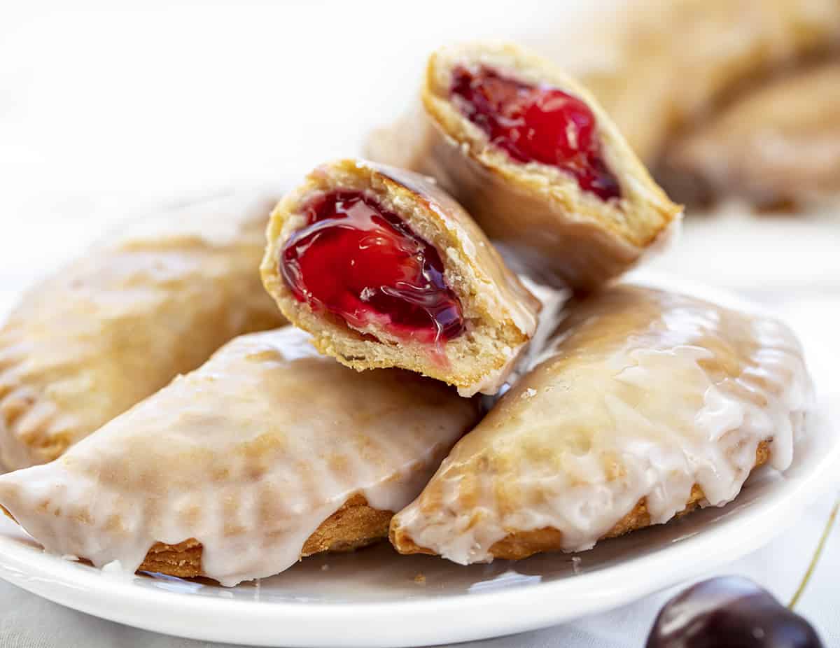 Broke in Half Cherry Hand Pies. Dessert, Snack, Hand Pies, Fried Pies, Fried Hand Pies, Cherry Pies, Air Fryer Cherry Hand Pies, Fried Cherry Hand Pies, Oven Cherry Hand Pies, Cherry Desserts, Baking, Cherry Recipes, Christmas Recipes, Summer Desserts, i am baker, iambaker