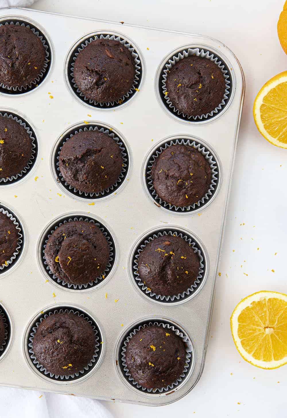 Overhead Pan of Chocolate Orange Muffins Just After Baking