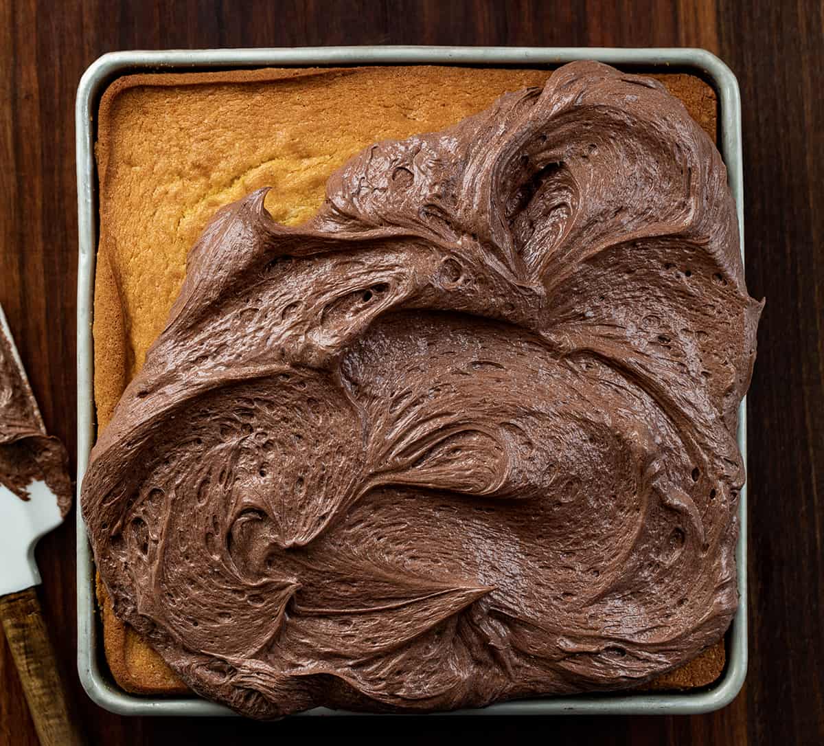 Partially frosted yellow cake using Chocolate Ermine Frosting.