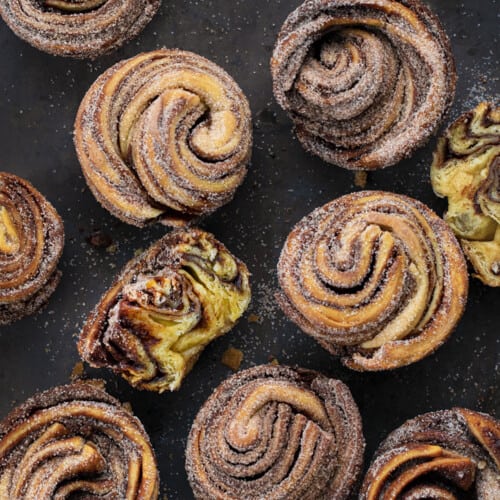 Chocolate Peppermint Cruffins from OVerhead with One Cut in Half Showing Inside Texture.