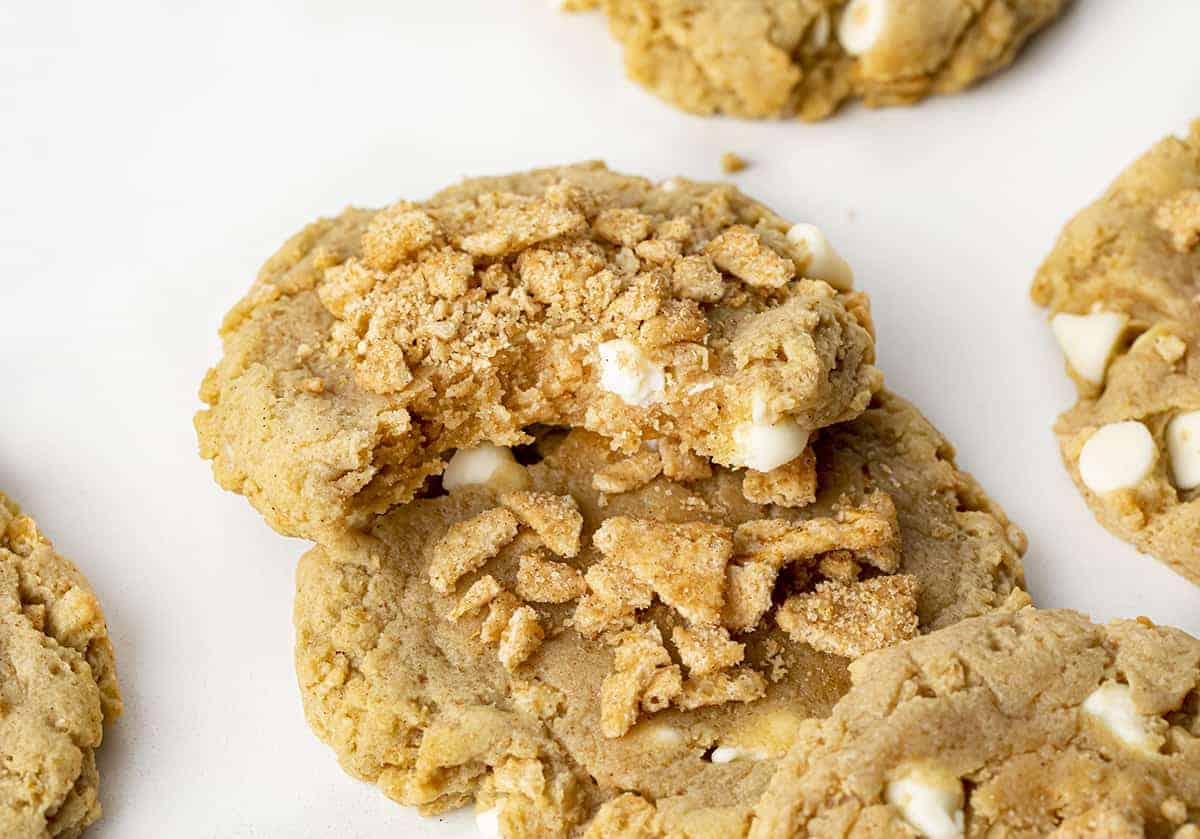 Bit Into Cinnamon Toast Crunch Cookie Resting on Another Cookie.