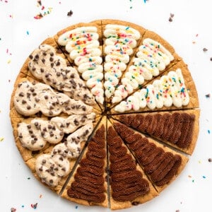 Cookie Cake for a Crowd with Chocolate Frosting, Vanilla Frosting, and Cookie Dough Frosting.