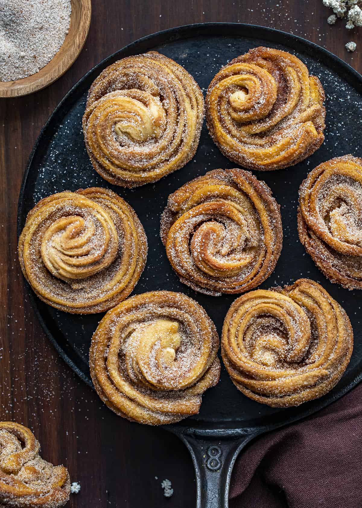 Overhead of Cruffins on a Black Serving Plate. Baking, Breakfast, Cruffins, Croissant Muffins, Easy Cruffins, Easy Cruffin Recipe, Fall Baking, Cinnamon Cruffins, Cinnamon Sugar Cruffins, Dessert, Breakfast Ideas, Brunch Recipes, i am baker, iambaker