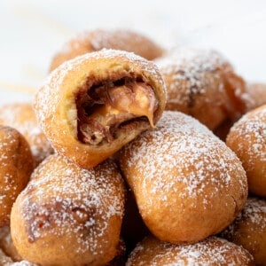 Stack of Deep Fried Snickers with One Bit Into.