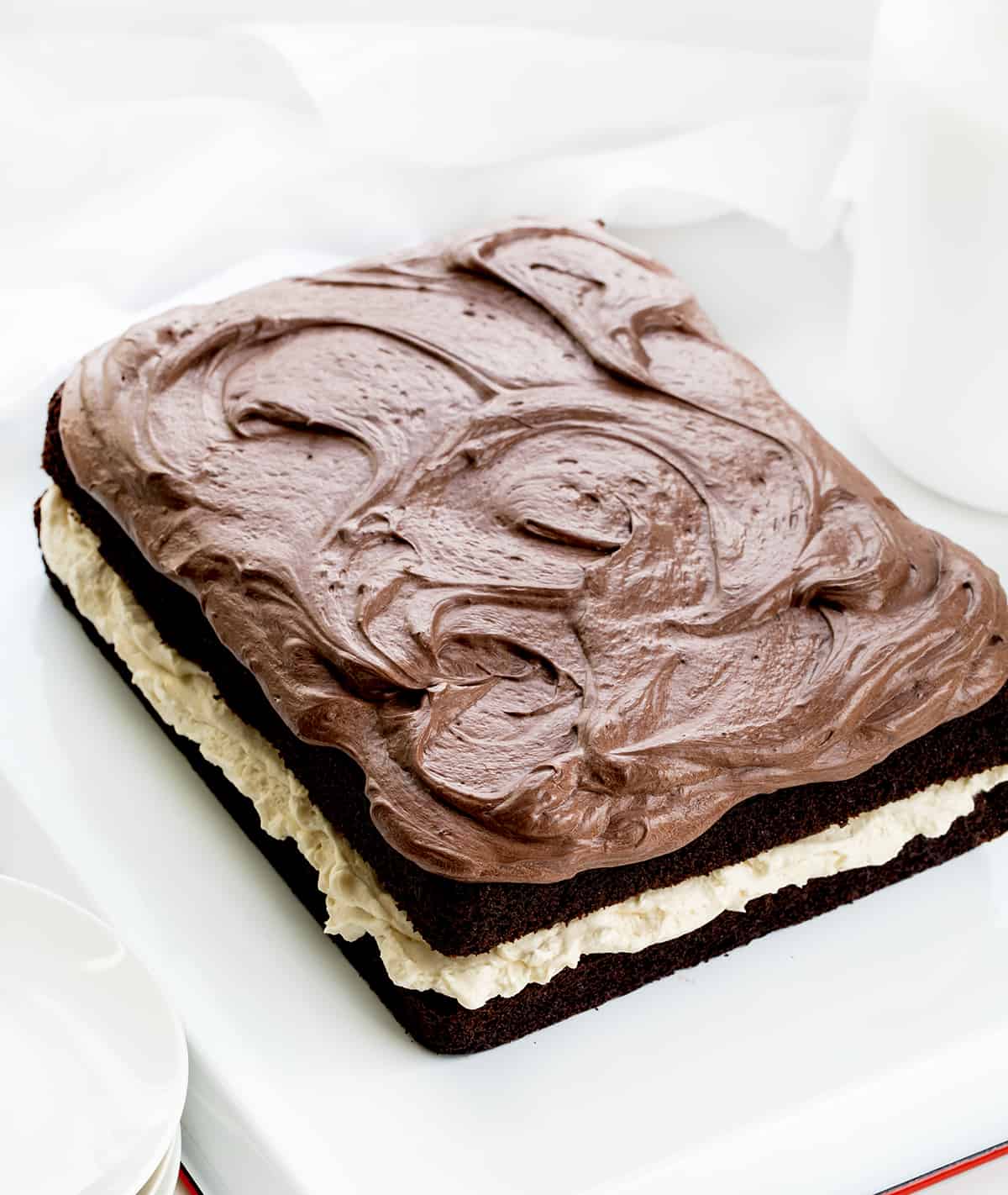 Ding Dong Sheet Cake from A bit Higher Up Showing it Topped with Chocolate Ermine on a White Counter.