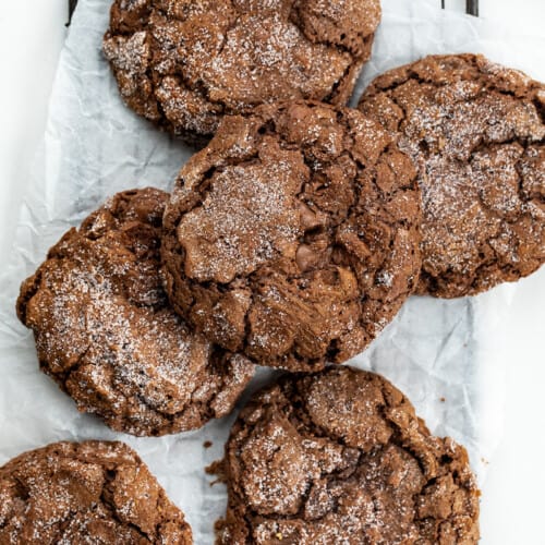 Dirty Chocolate Cookies Stacked on a Cooling Rack.