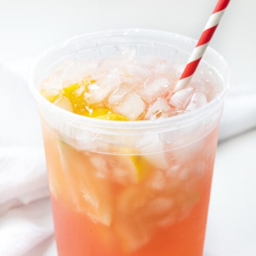 State Fair Strawberry Lemonade in a Container on a White Counter.