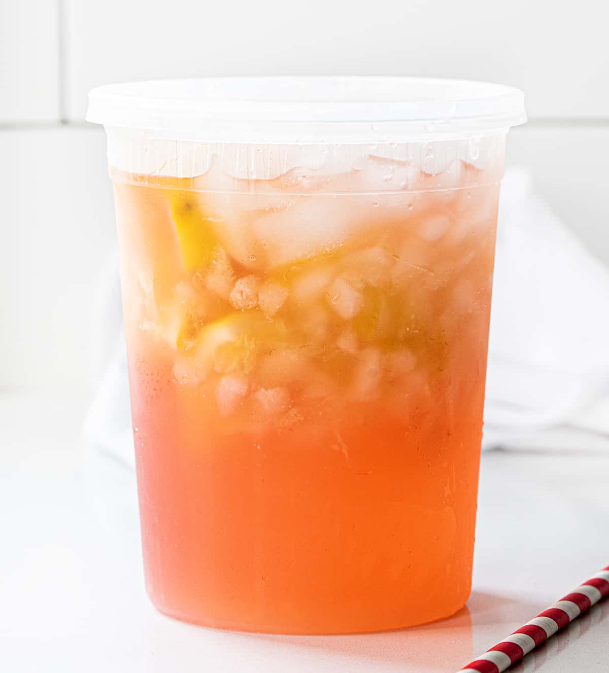 State Fair Strawberry Lemonade in a Container on a White Counter.