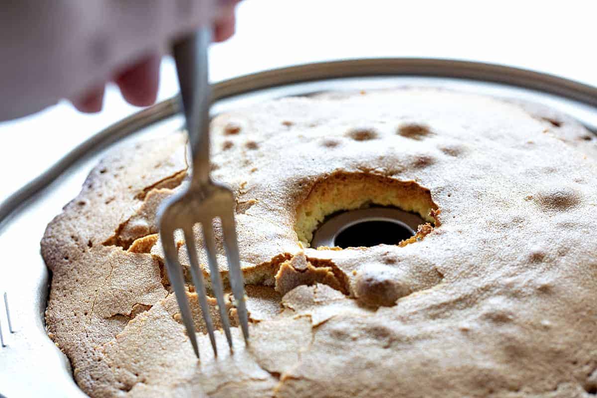 A perfect buttery pound cake with the most delicate crumb is topped with a pecan butter glaze. It's a SHOWSTOPPER!! pound cake, cake baking, kentucky butter crunch cake, kentucky butter cake, butter cake, iambaker, kentucky cake, butter crunch cake, dessert, best desserts, best cake Cracking the Crust on a Kentucky Butter Crunch Cake