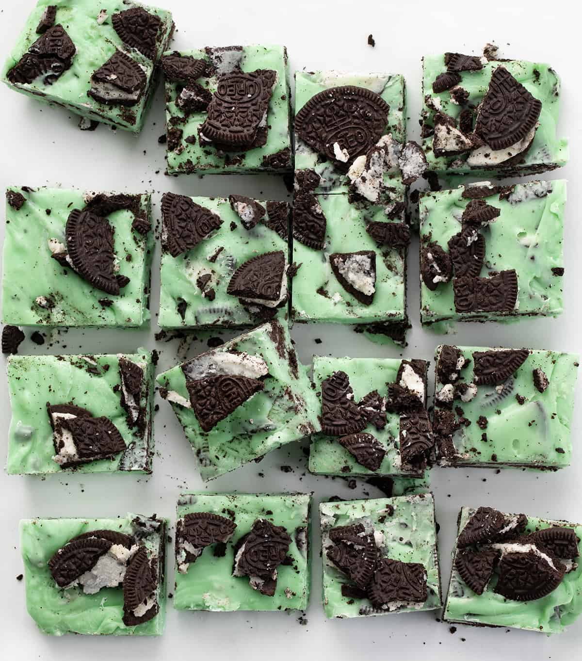 Creamy, no-fuss Mint Chocolate Oreo Fudge needs to be the next recipe on your dessert line-up. This delicious mint and chocolate cookie treat will have your guests coming back for seconds and thirds. A batch of Mint Oreo Fudge Cut Into Pieces.