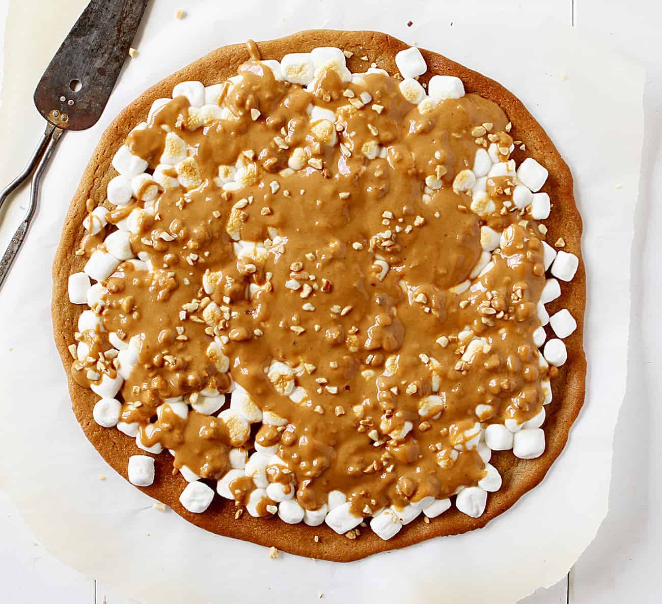 Overhead of Peanut Butter Marshmallow Dessert Pizza on Parchment Paper