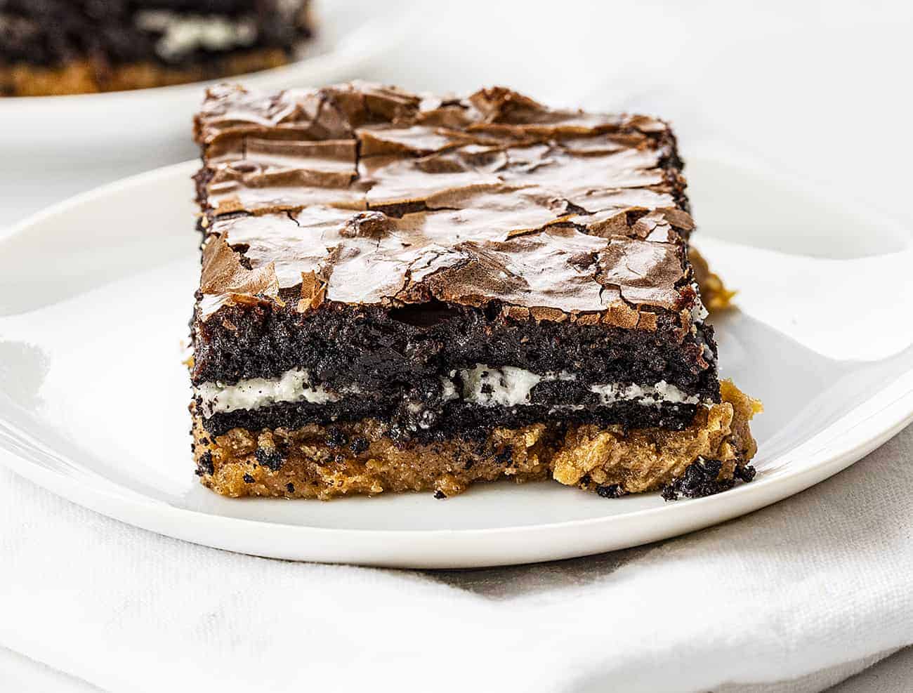 Peanut Butter Slutty Brownies on White Plate on White Napkin