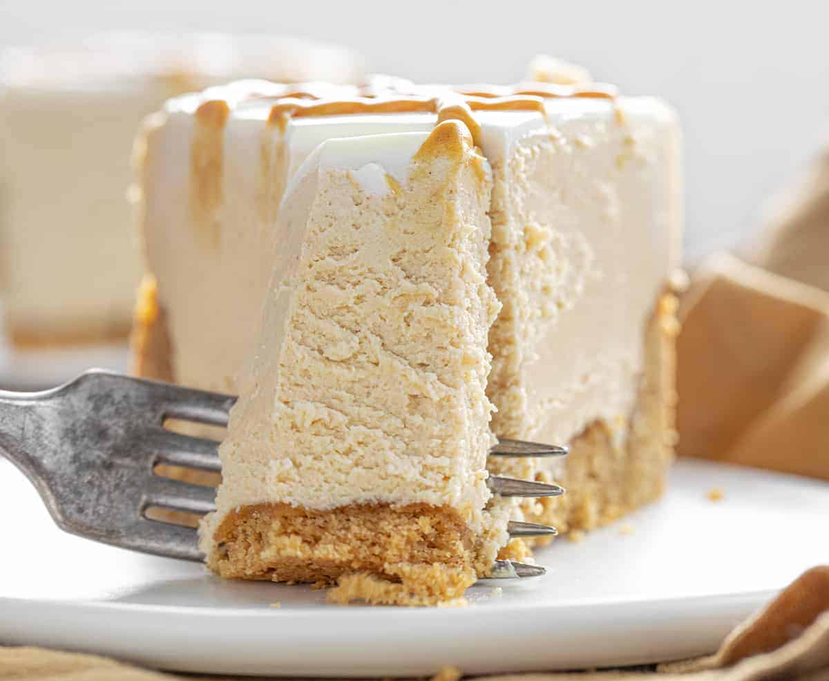 Fork Taking Bite of Peanut Butter Cheesecake