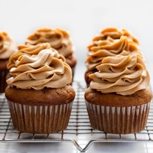 Frosted Pumpkin Spice Latte Cupcakes on a Cooling Rack. Cupcakes, Baking, Decorated Cupcakes, Frosted Cupcakes, Pumpkin Spice Cupcakes, Coffee Frosting, Dessert, Holiday Desserts, Christmas Dessert, Thanksgiving Desserts, Thanksgiving Cupcakes, Starbucks Cupcakes, i am baker, iambaker