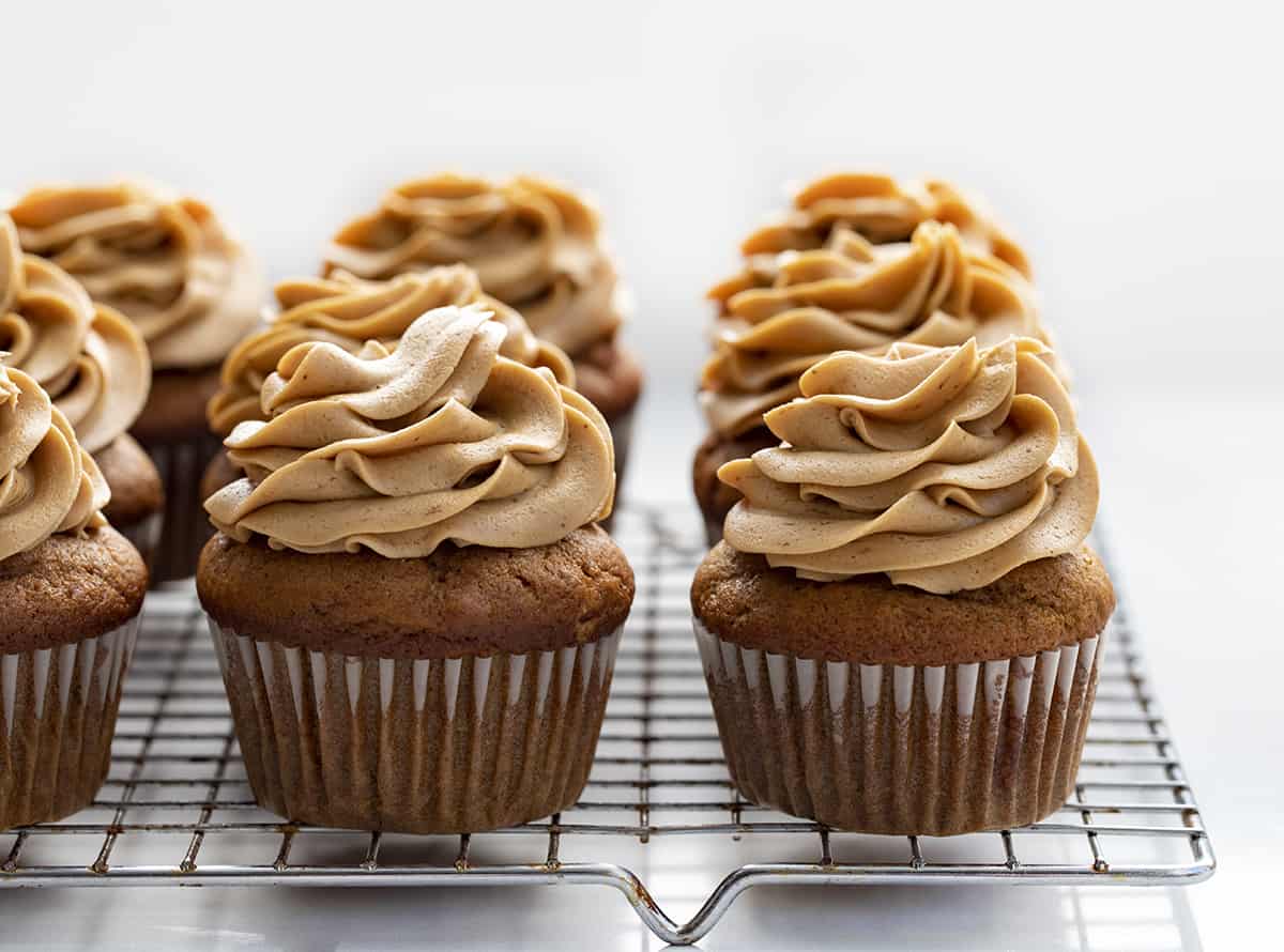 Frosted Pumpkin Spice Latte Cupcakes on a Cooling Rack. Cupcakes, Baking, Decorated Cupcakes, Frosted Cupcakes, Pumpkin Spice Cupcakes, Coffee Frosting, Dessert, Holiday Desserts, Christmas Dessert, Thanksgiving Desserts, Thanksgiving Cupcakes, Starbucks Cupcakes, i am baker, iambaker