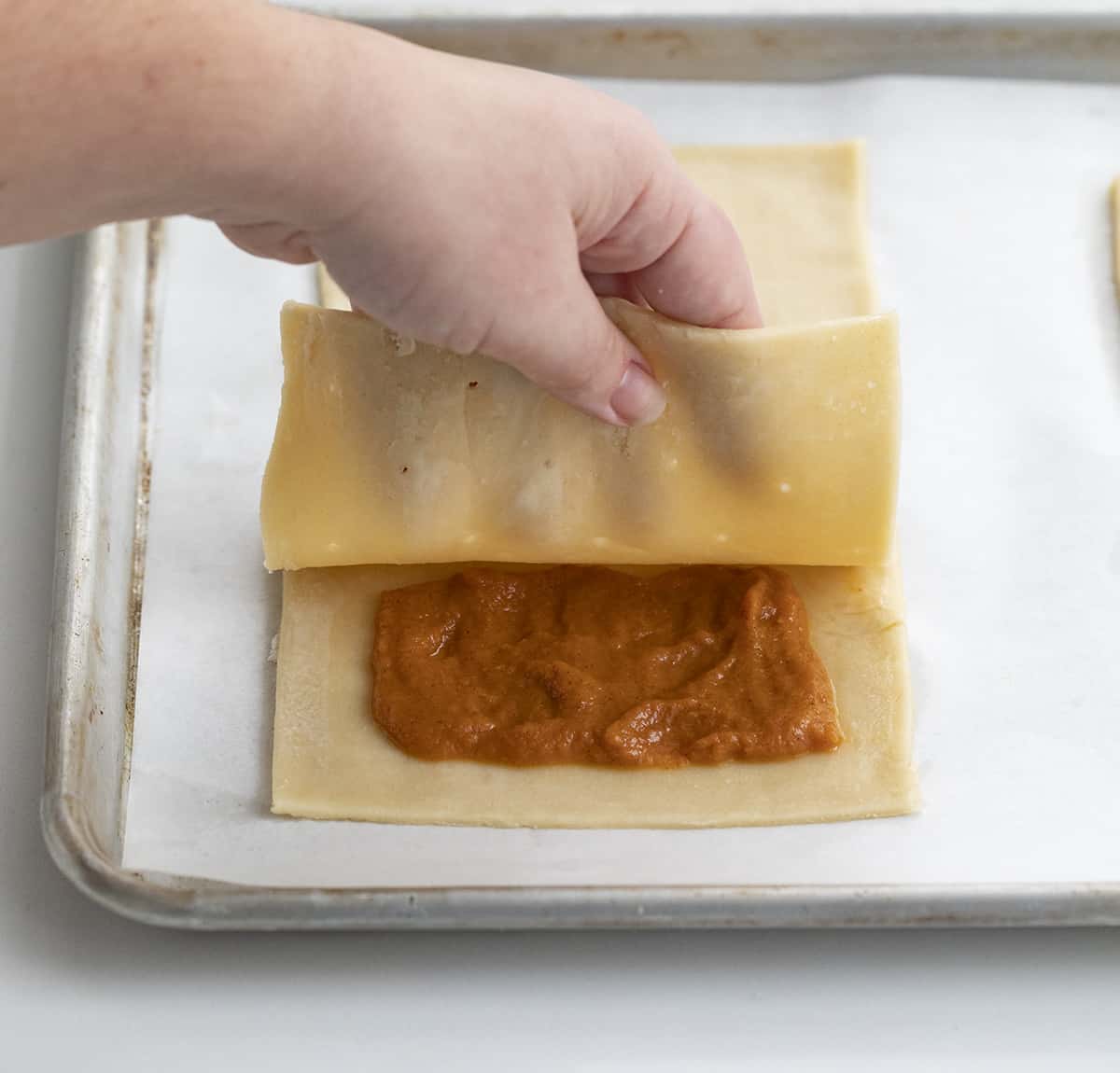 Assembling Pumpkin Pop Tarts by Adding Top Layer of Pie Dough Over Pumpkin Puree. Breakfast, Pumpkin Dessert, Pumpkin Recipes, Baking, How to Make Pop Tarts, Breakfast Recipe Ideas, Dessert, Snacks, Treats, Fall Treats, Fall Baking Recipes, i am baker, iambaker