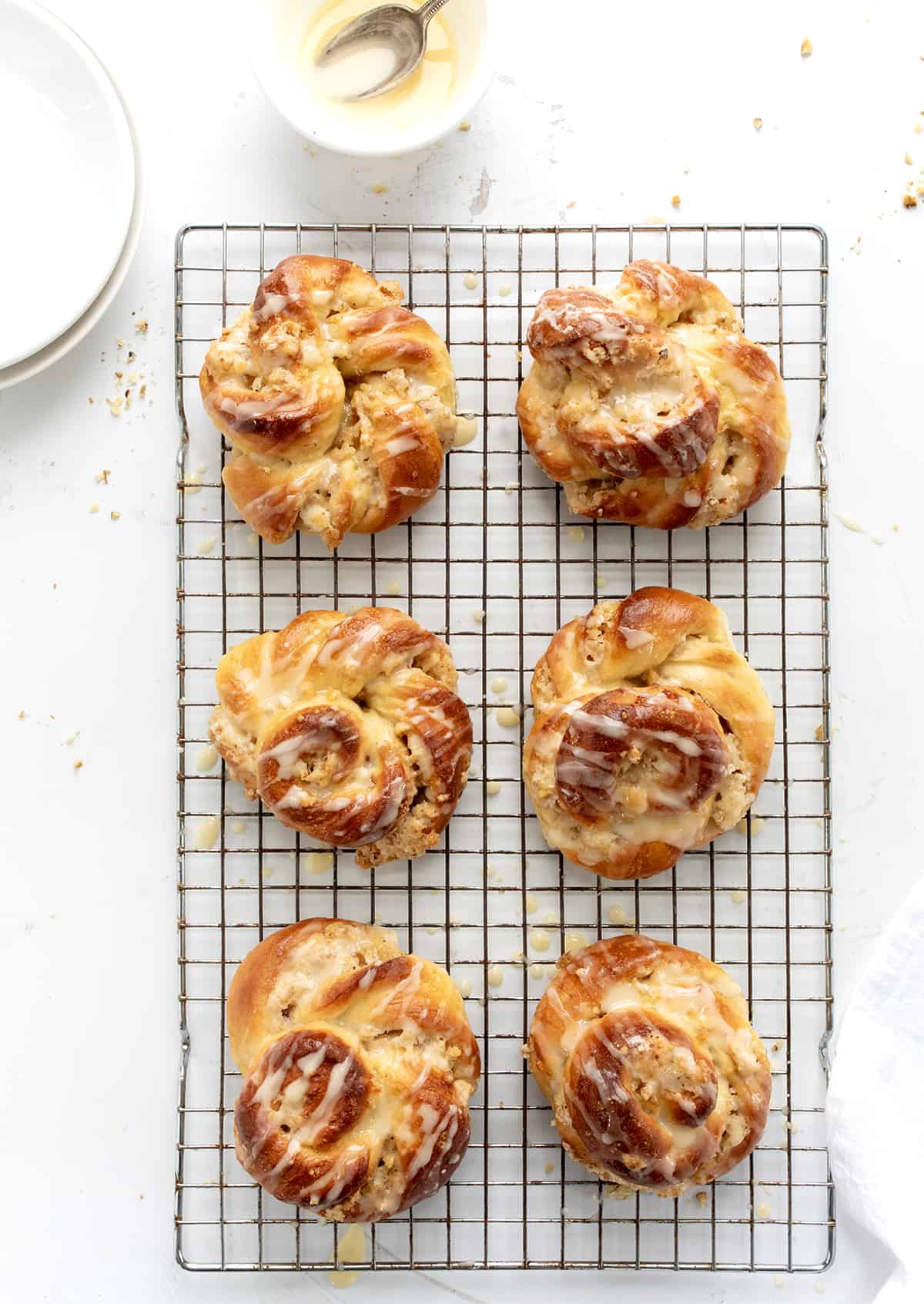 Baked Ring A Ling Pastry on a Rack with Glaze from Overhead.