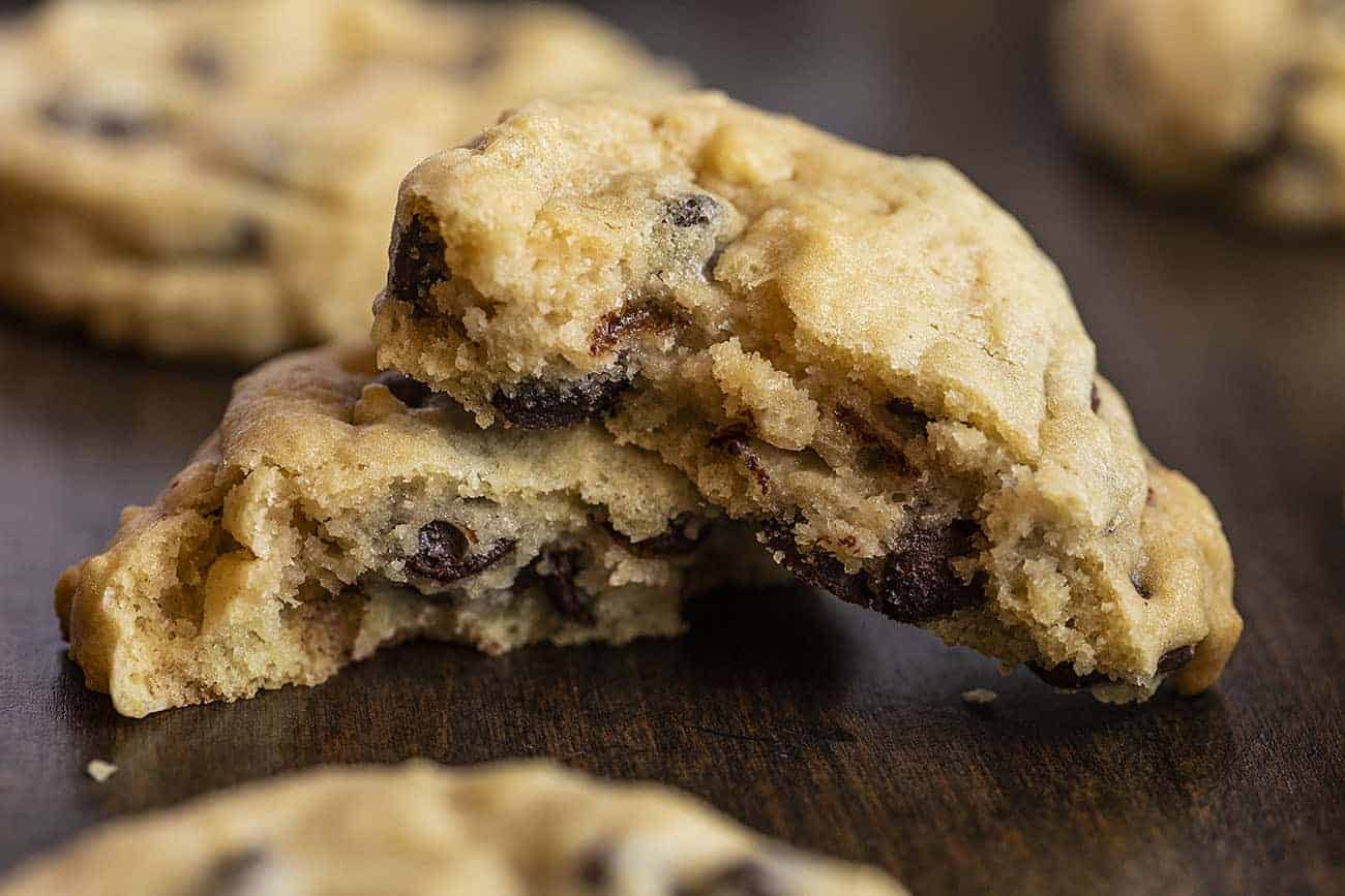 Use your sourdough starter discard to make these Sourdough Chocolate Chip Cookies as cake-like or as chewy as you prefer! sourdough chocolate chip cookies, chocolate chip cookies recipe, sourdough starter, how to make sourdough chocolate chip cookies, iambaker, i am baker, cookies, desserts Chewy Sourdough Chocolate Chip Cookies Broke in Half to See the Inside