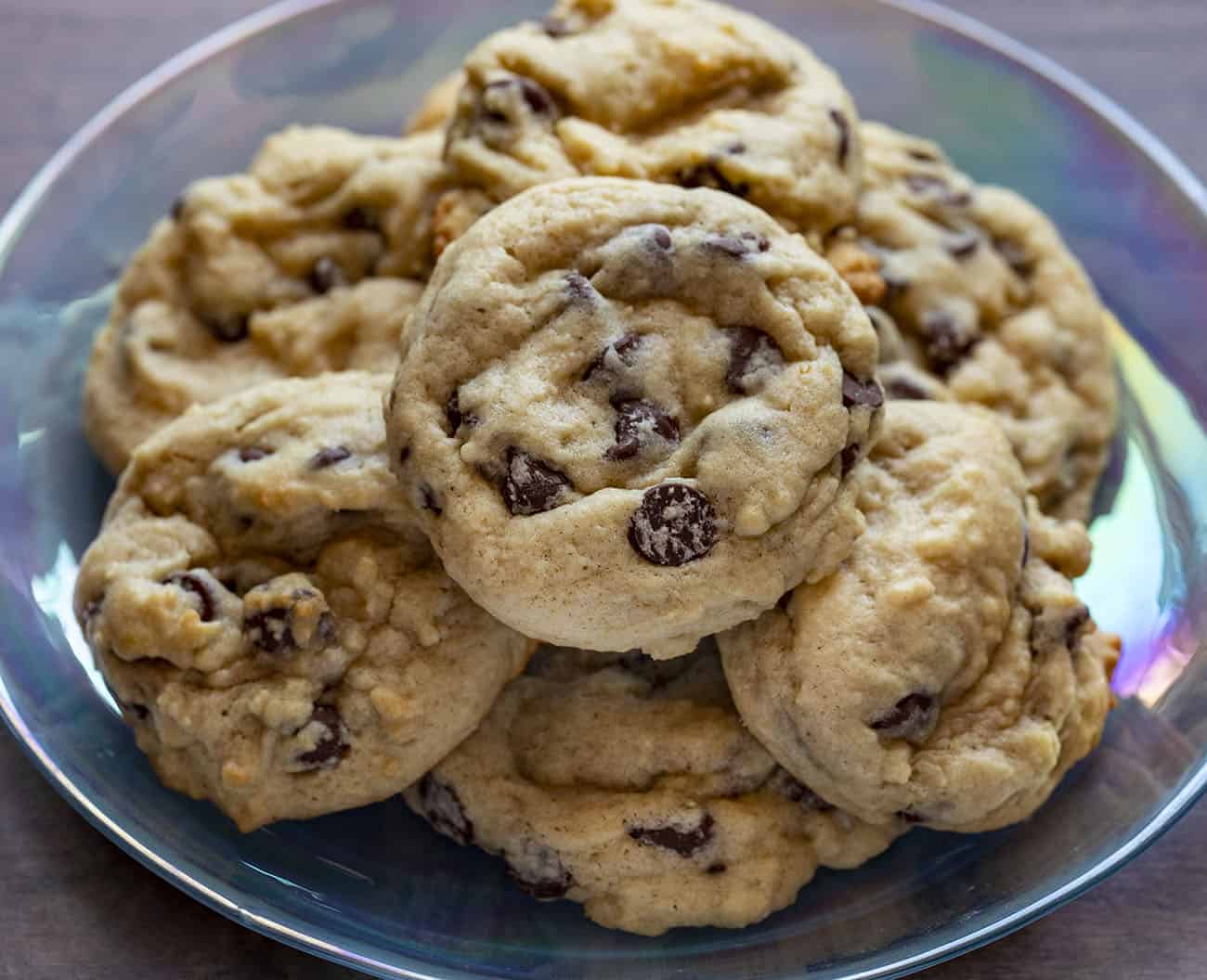 Use your sourdough starter discard to make these Sourdough Chocolate Chip Cookies as cake-like or as chewy as you prefer! sourdough chocolate chip cookies, chocolate chip cookies recipe, sourdough starter, how to make sourdough chocolate chip cookies, iambaker, i am baker, cookies, desserts Sourdough Chocolate Chip Cookies Stacked on Plate