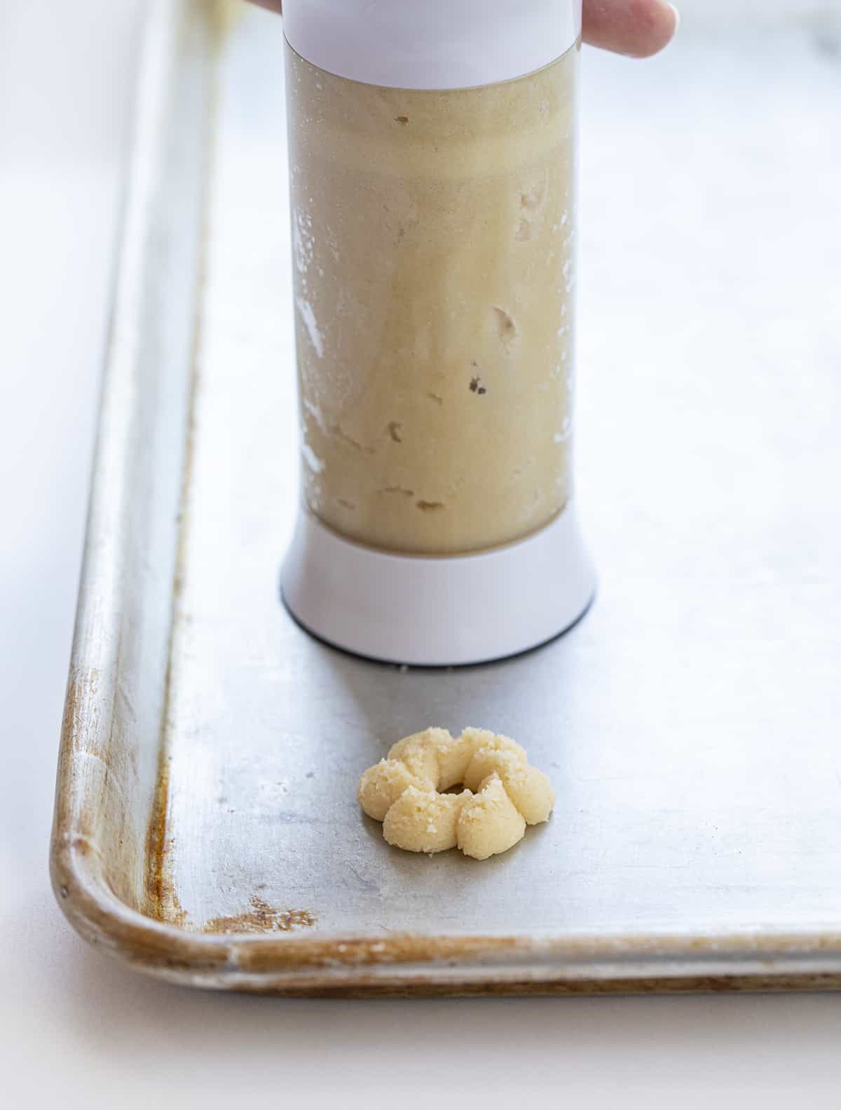 Using A Cookie Press for Spritz Cookies. Baking, Cookies, Spritz Cookies, How to Make Spritz Cookies Without Cookie Press, Cookie Exchange Cookies, Best Spritz Cookie Recipes, Perfect Spritz Cookies, Best Pan for Spritz Cookies, Christmas Cookie Recipes, Christmas Cookie Ideas, Holiday Baking, Dessert, i am baker, iambaker