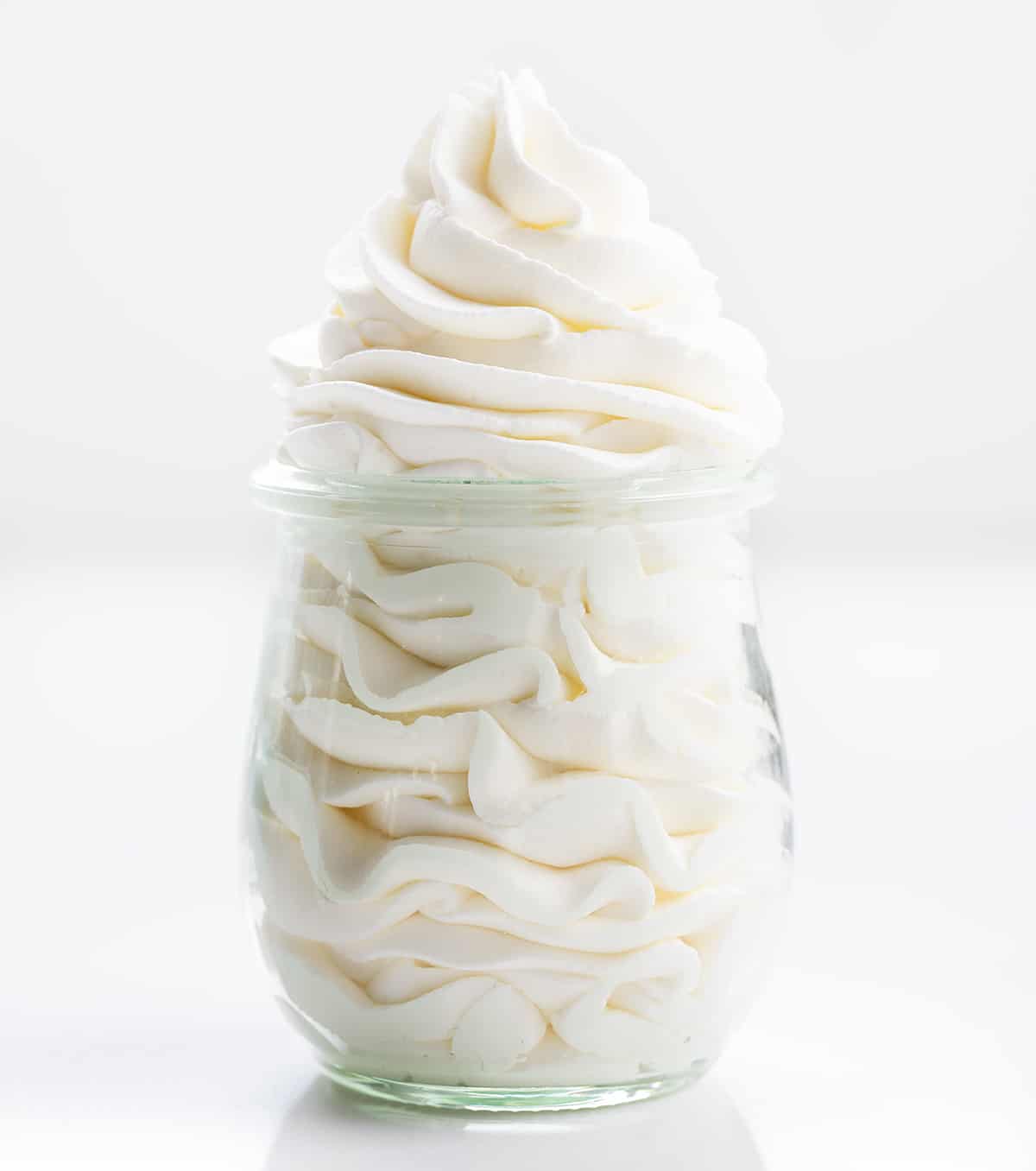 Stabilized Whipped Cream is a versatile ingredient that can be used in many types of desserts from frosting to filling to a topping. It tastes like homemade whipped cream (delicious!), it holds its shape beautifully, and it lasts for days! This just might be my new favorite addition to all my favorite desserts! Jae of Piped Stabilized Whipped Cream.