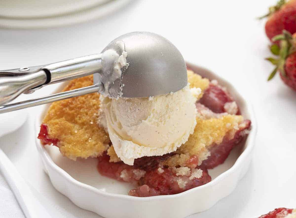Fresh Strawberry Cobbler is a perfect summertime dessert that can be put together in minutes and features fresh strawberries. Strawberry Cobbler, Fresh Strawberry Cobbler, How to Make Strawberry Cobbler, Cobble Recipes, Easy Cobbler, From-Scratch Cobbler, Baking, Dessert, Summer Dessert, Easy Dessert, iambaker, i am baker Dish of Real Strawberry Cobbler