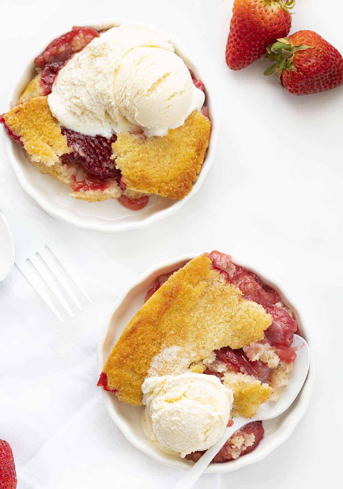 Fresh Strawberry Cobbler is a perfect summertime dessert that can be put together in minutes and features fresh strawberries. Strawberry Cobbler, Fresh Strawberry Cobbler, How to Make Strawberry Cobbler, Cobble Recipes, Easy Cobbler, From-Scratch Cobbler, Baking, Dessert, Summer Dessert, Easy Dessert, iambaker, i am baker Plates of Strawberry Cobbler
