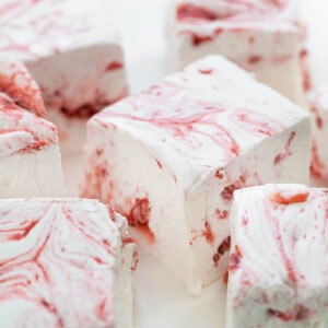 Cut up Strawberry Marshmallows on a White Counter.