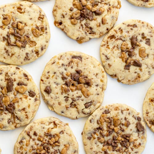 Overhead of Toffee Icebox Cookies. Cookies, Baking, Icebox Cookies, Toffee Cookies, Chocolate Toffee Cookies, Cookie Recipes, Can You Freeze Cookies, Shortbread Cookies, Dessert, i am baker, iambaker