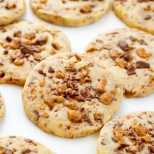 Close up of Toffee Icebox Cookies on White Counter. Cookies, Baking, Icebox Cookies, Toffee Cookies, Chocolate Toffee Cookies, Cookie Recipes, Can You Freeze Cookies, Shortbread Cookies, Dessert, i am baker, iambaker