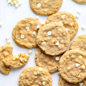 White Chocolate Macadamia Nut Cookies with White Chocolate Chips and a Broken in Half Cookie.